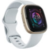 Fitbit Sense 2 smartklocka i Blue Mist och Soft Gold sedd snett framifrån